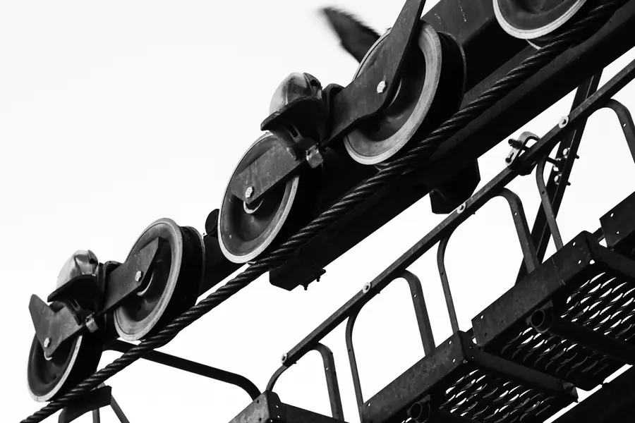 Steel ropes running over sheaves, in black and white